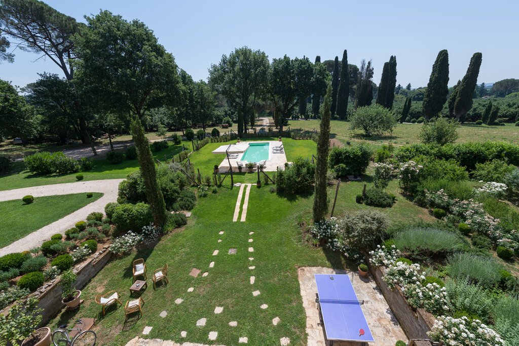 Extensive lawned gardens with table tennis and gated pool