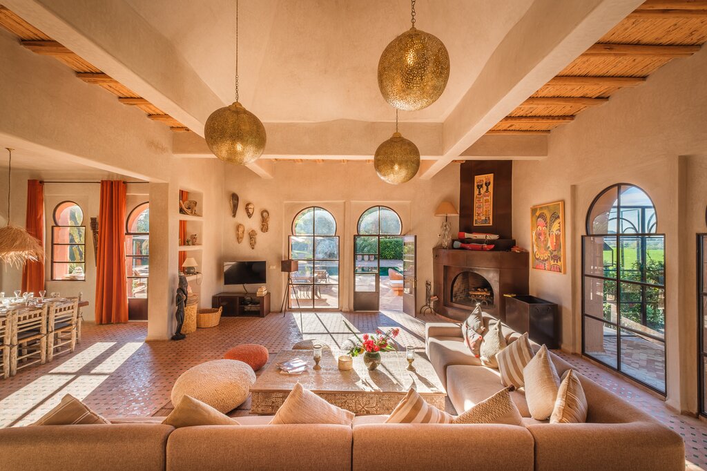 Sitting room with dining area opening to pool terrace